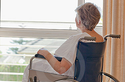 senior-woman-her-wheelchair-18255317